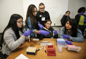 Students from Orthopaedic Hospital Medical Magnet High School practice using pipettes to handle small amounts of liquid. (Photo/David Sprague)