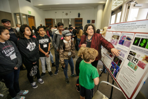 Francesca Mariani describes her research at the Stem Cell Day of Discovery event. (Photo/David Sprague)