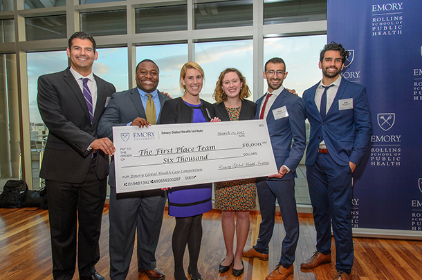 From left, Julian Cernuda, Brantynn Washington, Ashley Millhouse, Cristina Gago, Hrant Gevorgian and Zaki Hasnain hold a novelty check after winning first place in the Emory Global Health Case Competition on March 25.
