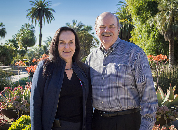 Zea Borok, left, and John Reith, chair of the board of the Hastings Foundation, are seen at the entrance to the Huntington Botanical Gardens.