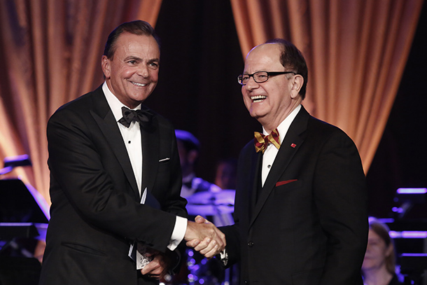 Rick Caruso, left, receives the Asa V. Call Award from USC President C. L. Max Nikias. 