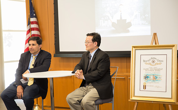 Mark Humayun, left, moderates a discussion with Bin He during the Dean’s Distinguished Lecturer Series, held April 10 on the Health Sciences Campus.