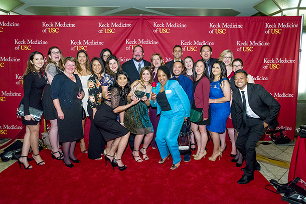 Members of the USC Verdugo Hills Hospital emergency department smile after receiving the team award at the USC Choi Family Awards for Excellence in Patient-Centered Care.