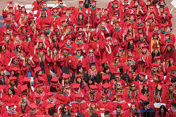 Graduates cheer during the 2016 USC Commencement Ceremony.