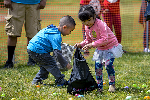 Children take part in an Easter egg hunt during the USC civic engagement health fair, Saturday, April 8, 2017. (Photo by Gus Ruelas)