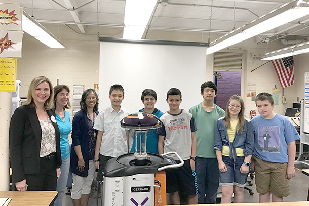 From left, Mary Virgallito, USC-VHH director of patient safety; Erin Lynch, forensics teacher; Celine Young, STEM teacher; Danny Zhou; Anthony Gregorian; Daniel Khoshnudyan; Andrew Bielek; Abby Clark; and Eric Peterson are seen with the Xenex robot named Luna.