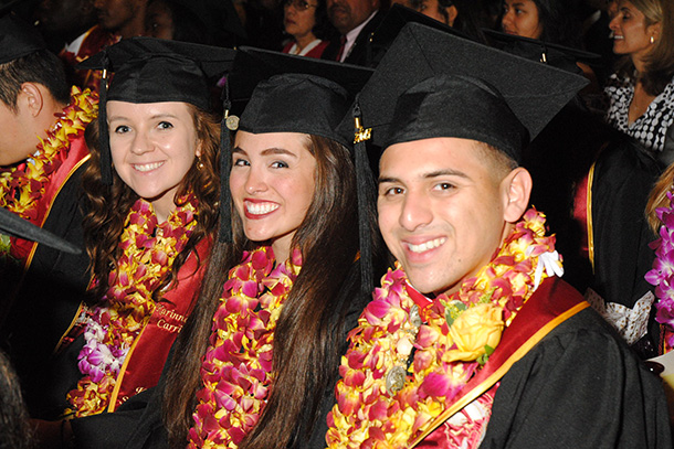 Graduates from the Keck School of Medicine of USC’s Health Promotion and Global Health programs smile during a satellite commencement ceremony, May 12 on the University Park Campus.
