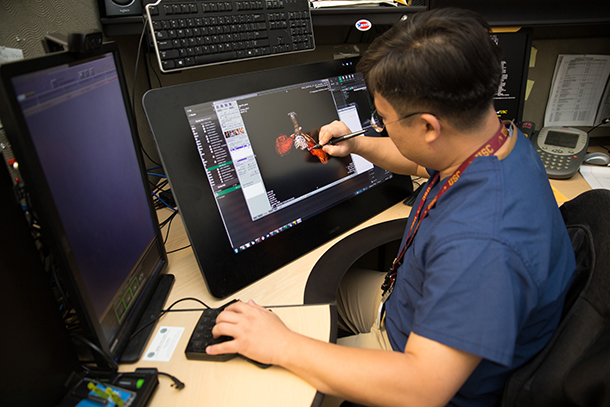 Darryl Hwang works with an image in the USC 4D Quantitative Imaging Center.