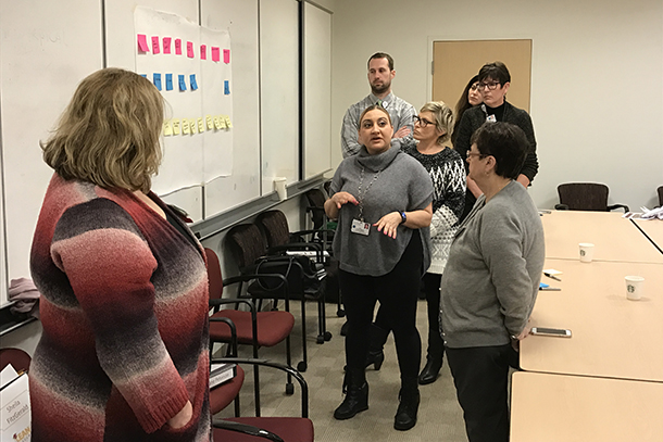 Staff members participate in discussions during a recent HSC Lean Academy class.