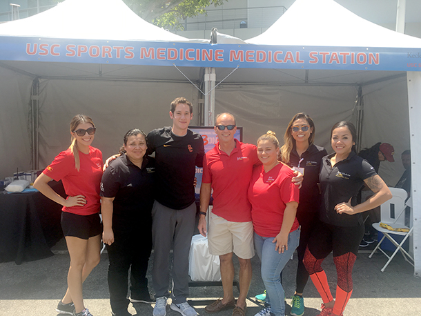 From left, Danielle Viveros, Fatima Marroquin, Alexander Weber, Rod Hanners, Sylvia Hernandez, Natasha Buranasombati and Adah Ortega are seen in front of a first aid station during the Nike Basketball 3on3 tournament.