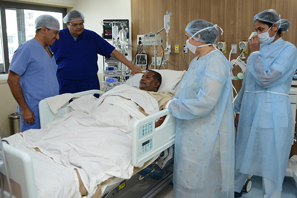 Inderbir Gill, left, is joined by the surgical care team at Sir H. N. Reliance Foundation Hospital in Mumbai after performing a robotic kidney transplant on a 59-year-old patient.