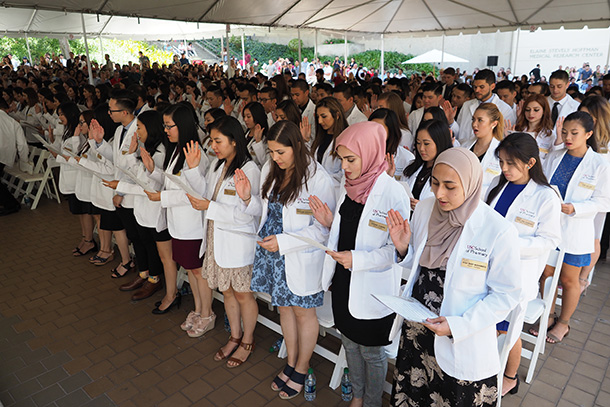 192 members of the Class of 2021 take the Oath of a Pharmacist led by Kevin Forrester, associate professor of clinical pharmacy.