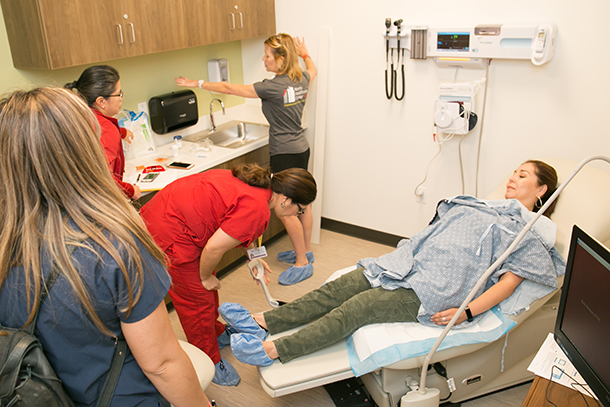 Keck Medicine of USC employees participate in a patient care scenario during a “Day in the Life” preview event held Oct. 26 at Norris Healthcare Center.