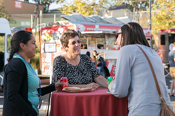 Keck School of Medicine of USC Interim Dean Laura Mosqueda speaks with students during the Student and Postdoc Appreciation International Food Truck Festival, held Oct. 26 on the Health Sciences Campus.