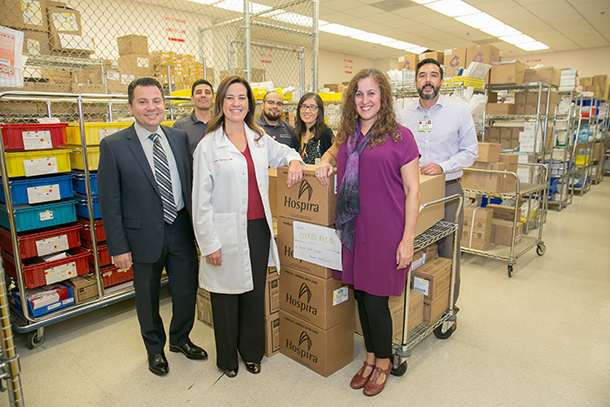 Volunteers from the USC Norris Comprehensive Cancer Center, including administration, pharmacy and maintenance management, pack boxes of basic drugs and medical supplies to ship directly to the University of Puerto Rico Medical Center.