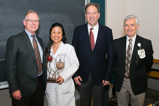 From left, Vaughn Starnes, Lydia Lam, Etan Chaim Milgrom and Peter Crookes are seen during the presentation of the Etz Chaim Tree of Life Award of Compassionate Care presentation on Dec. 15 at the Health Sciences Campus.