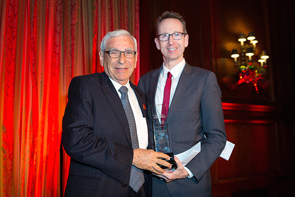Ed Crandall, left, received the award for Extraordinary Achievement in Academics and Science from the University Kidney Research Organization, presented by USC Provost Michael Quick, right, during the UKRO 2017 benefit gala on Dec. 8.