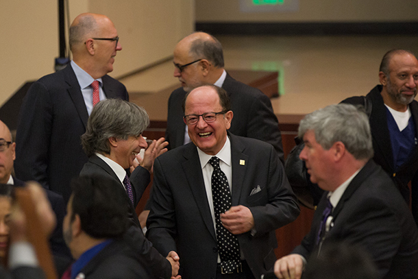 USC President C. L. Max Nikias greets faculty and staff after the annual State of the University address.