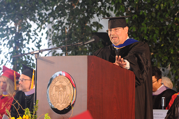 Michael Cousineau delivers the commencement address for the Herman Ostrow School of Dentistry of USC ceremony on May 11.