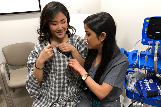 Med students Uni Choe and Sona Shah worked with a fashion designer to create a two-piece garment for hospital patients.