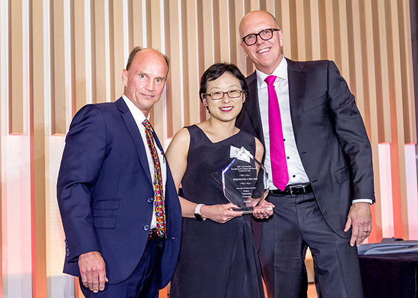 Stephanie Cho, center, receives a USC Choi Family Award from Rod Hanners, left, and Tom Jackiewicz.