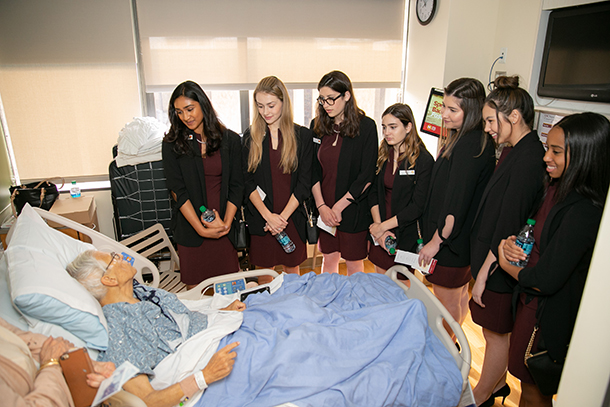 The Tournament of Roses 2019 Royal Court visits a patient at the USC Norris Comprehensive Cancer Center during the court’s annual visit on Nov. 19.