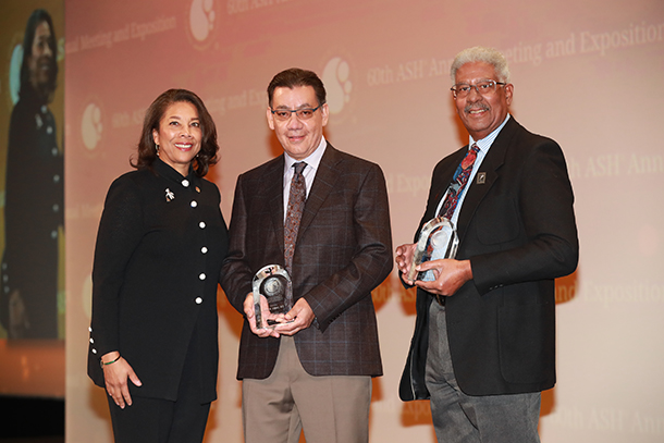 José Lopez, center, and Cage Johnson, right, receive the American Society of Hematology’s ASH Award for Leadership in Promoting Diversity from ASH President Alexis Thompson, left, during its 60th meeting and exposition on Dec. 2.