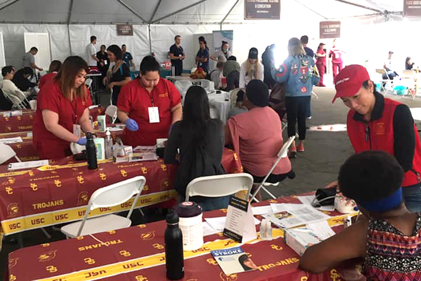 Keck Medicine of USC employees volunteer at the 2019 Skid Row Carnival of Love, offering stroke awareness education and health screenings.