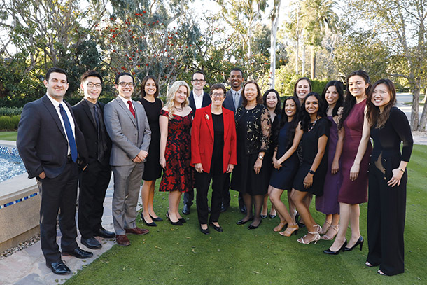 Scholarship recipients stand with Keck School Dean Laura Mosqueda, center, and Donna Elliott, center right, before the 2019 Scholarship Gala.