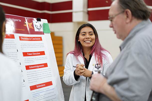 Students from Francisco Bravo Medical Magnet High School present their original research projects during the annual Bravo-USC Science and Engineering Fair.