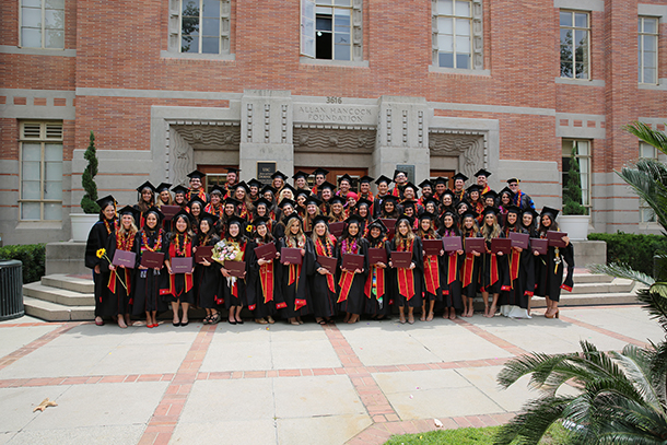 The Primary Care Physician Assistant Program Class of 2019 pose with Department of Family Medicine Chair Jehni Robinson, MD, and Program Director and Vice Chair of Education Kevin Lohenry, PhD, PA-C, following their commencement ceremony.