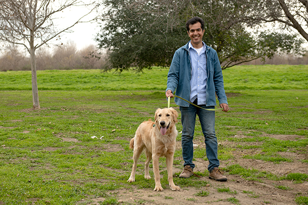 Khashayar Pirouzmand and his golden retriever puppy, Zomi, enjoy a day at the park.