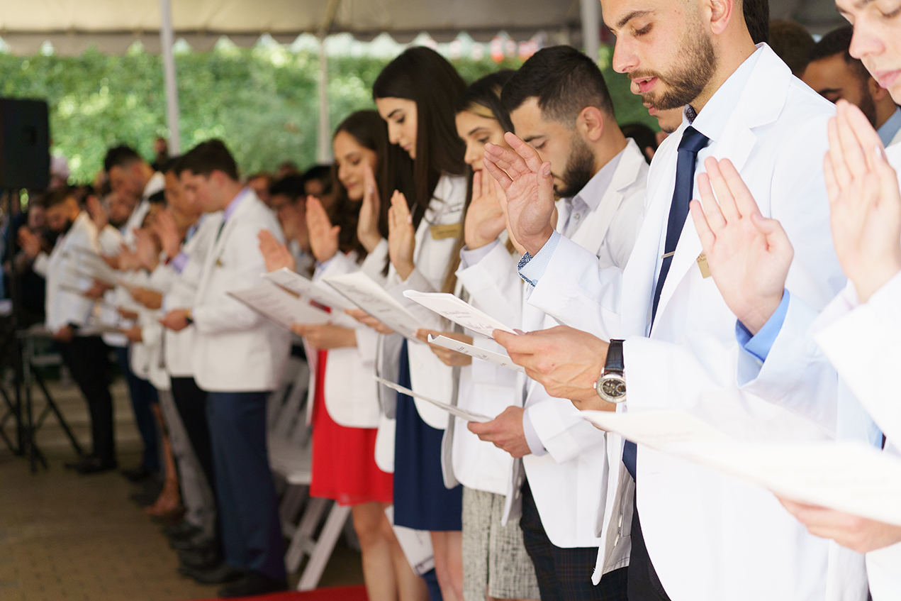 The 197 members of the PharmD Class of 2023 take the Oath of a Pharmacist during the 2019 White Coat Ceremony.