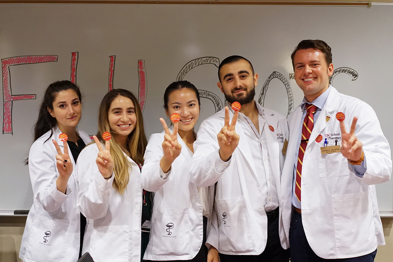 Pharmacy students offer free flu shots to USC faculty and staff during a recent heatlh screening event.