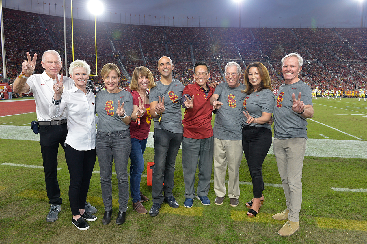 Physicians and staff from the USC Norris Comprehensive Cancer Center join patients on the United Airlines Field at the Los Angeles Memorial Coliseum during the Nov. 2 football game between the USC Trojans and Oregon Ducks.