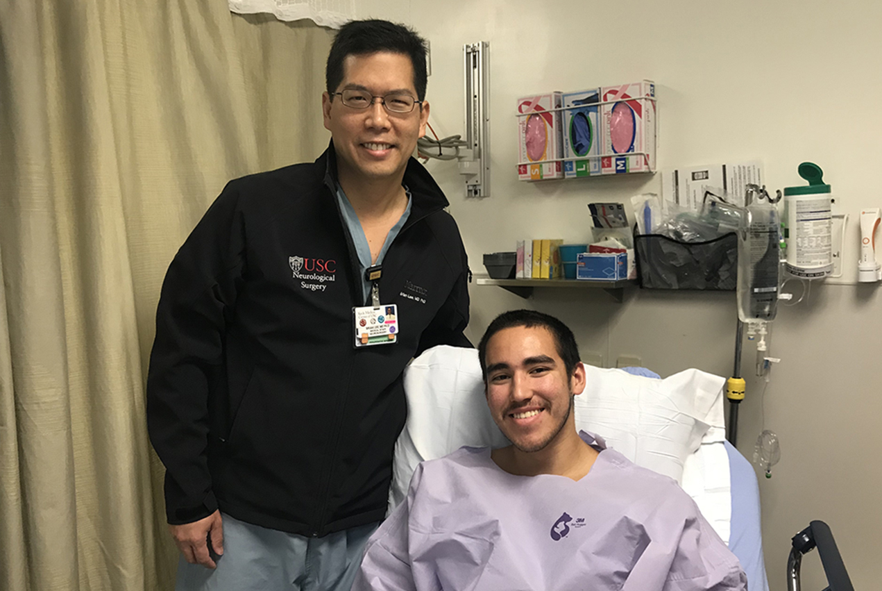 An innovative surgery performed by Brian Lee (left) has proven to be an effective treatment for Roy Reynosa (right), who had experienced epileptic seizures since the age of 12.