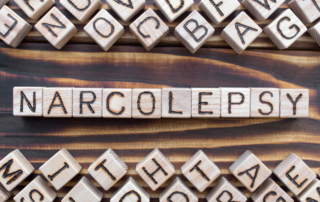 Lettered blocks spell out, "Narcolepsy."