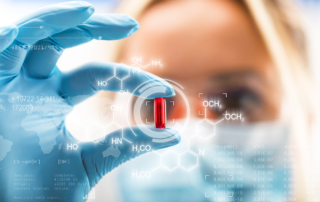 A blonde scientist holds up a red pill surrounded by graphics representing molecules.
