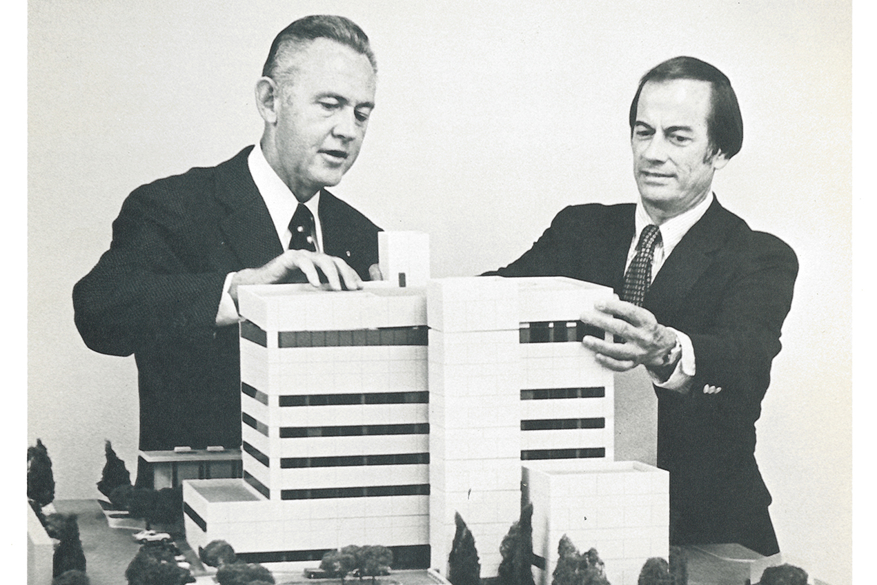 Kenneth Norris, Jr. (left) discusses plans for USC Norris Hospital with G. Denman Hammond.