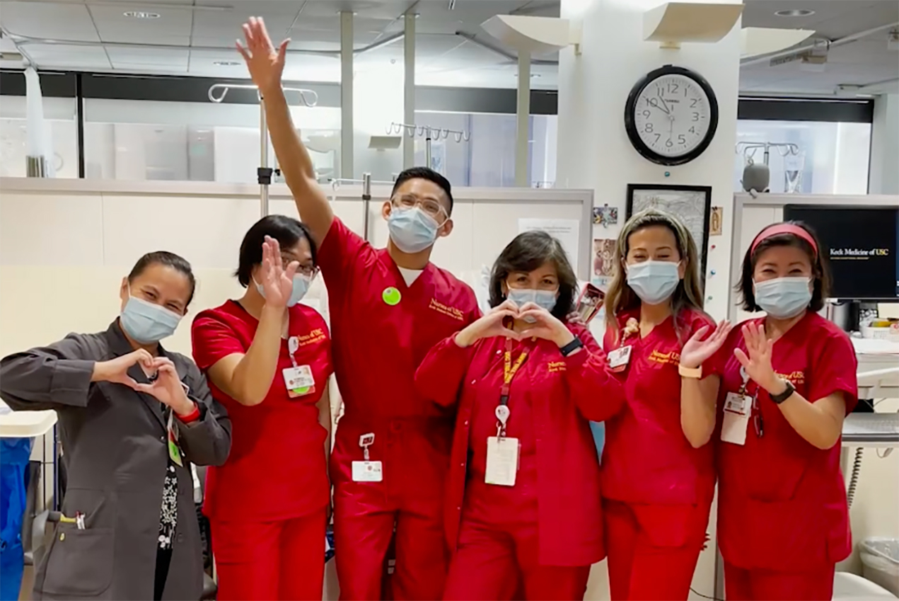 Physicians and staff are seen waving in a screenshot of the 31st annual Festival of Life hosted by USC Norris Comprehensive Cancer Center on June 5, 2021.