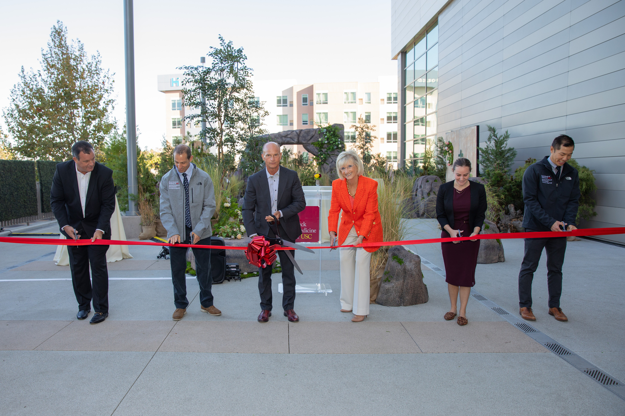 Rod Hanners, center left, and Tammy Capretta, center right, led a ribbon-cutting event on Oct. 19 for Emergence.