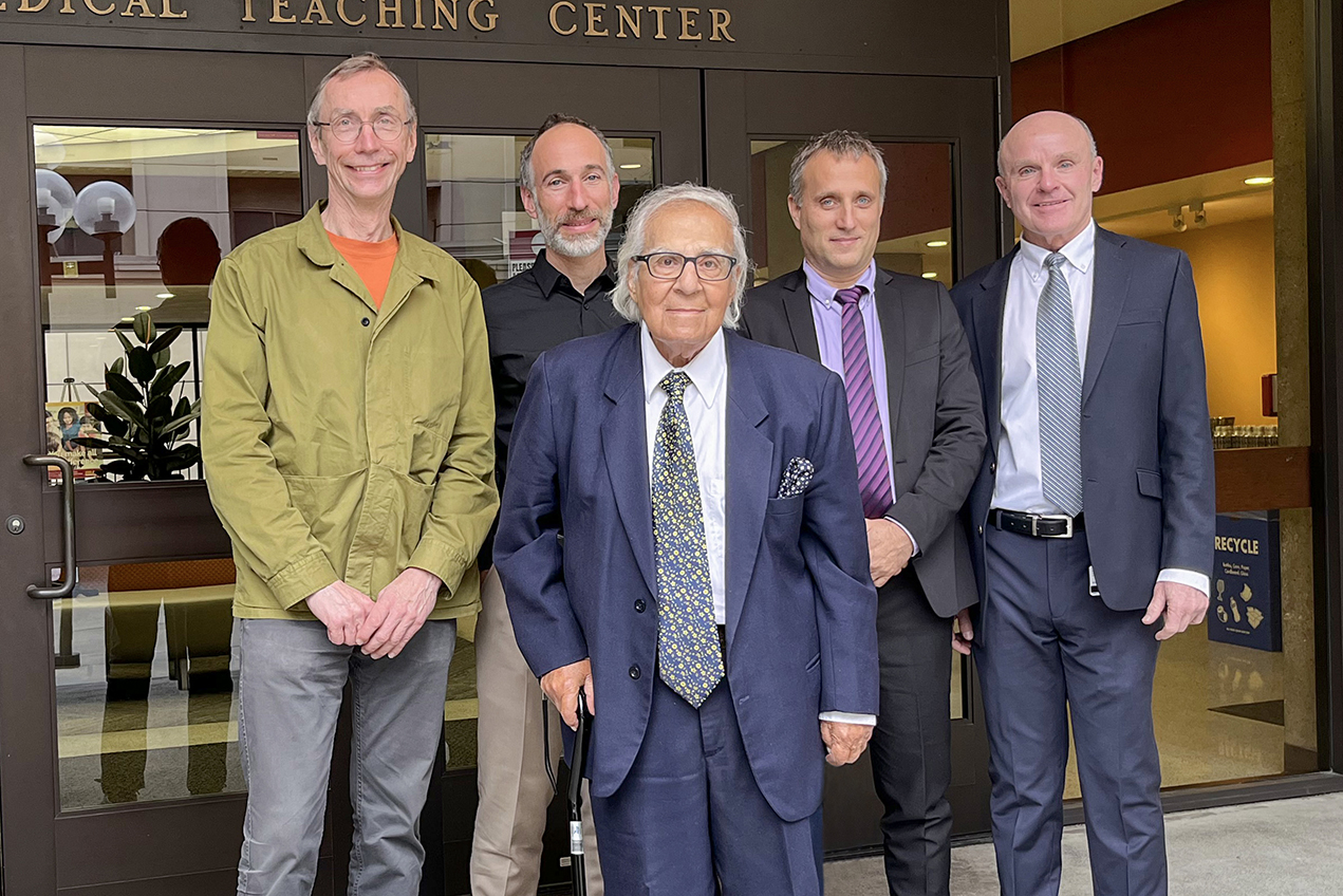From left, Svante Pääbo, David Reich, Shaul Massry, Liran Carmel and Thomas Buchanan are seen outside Mayer Auditorium and the Keith Administration Building ahead of the Massry Prize Lectures on Dec. 16.