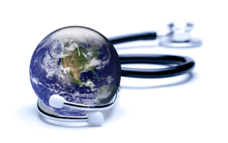 A stethoscope lies curled around a realistic miniature of the planet Earth.