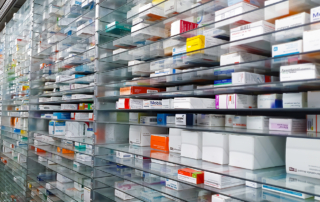 Medications fill the shelves of a pharmacy