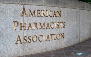A granite wall reads American Pharmacists Association