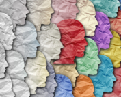 Wrinkled paper faces transition from gray to multicolored