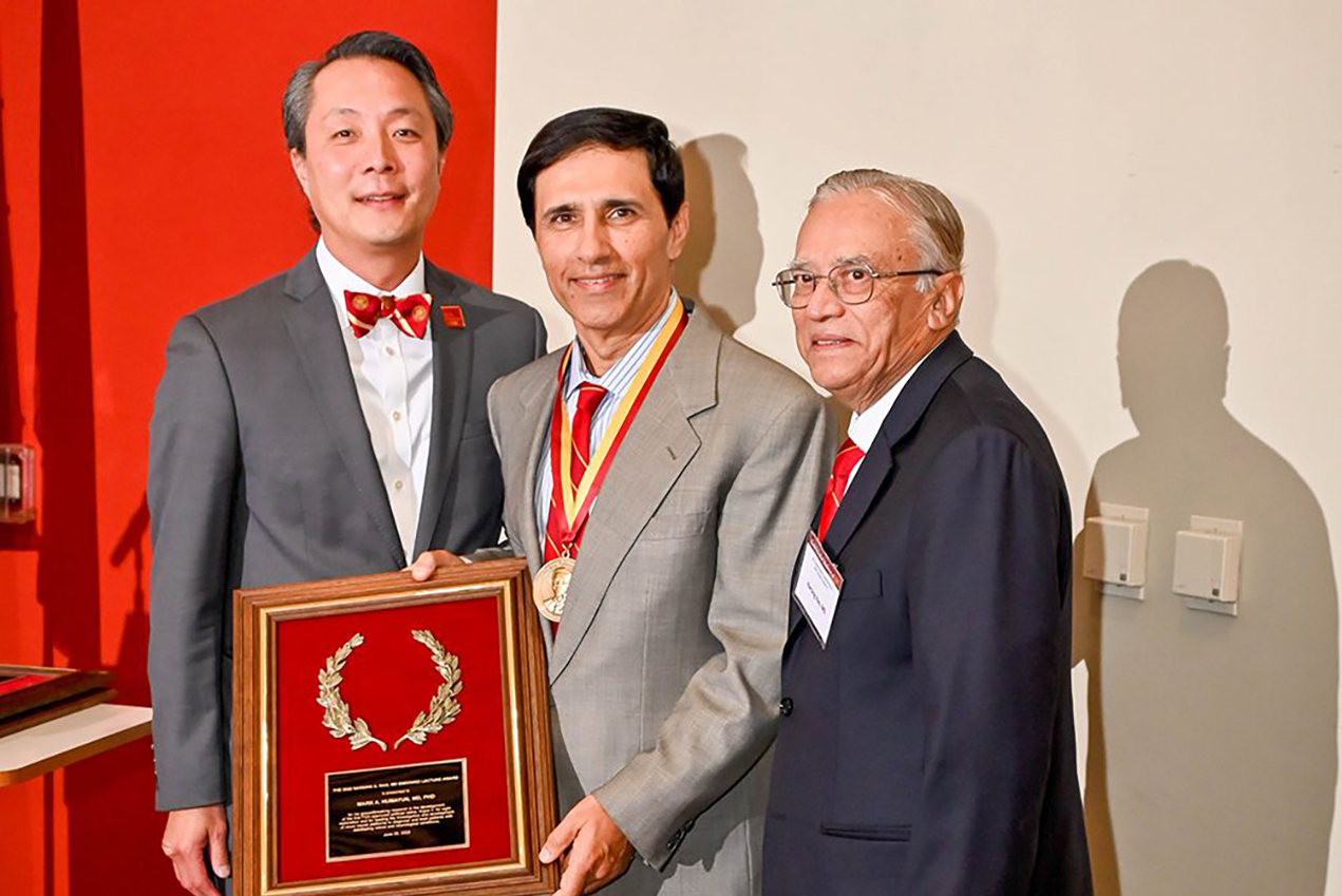 The event included an awards ceremony, where Mark Humayun, MD, PhD, (center) received the Narsing A. Rao, MD Endowed Lecture Award from from J. Martin Heur, MD, PhD (left) and Rao (right).