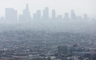 Downtown Los Angeles stands in thick smog.