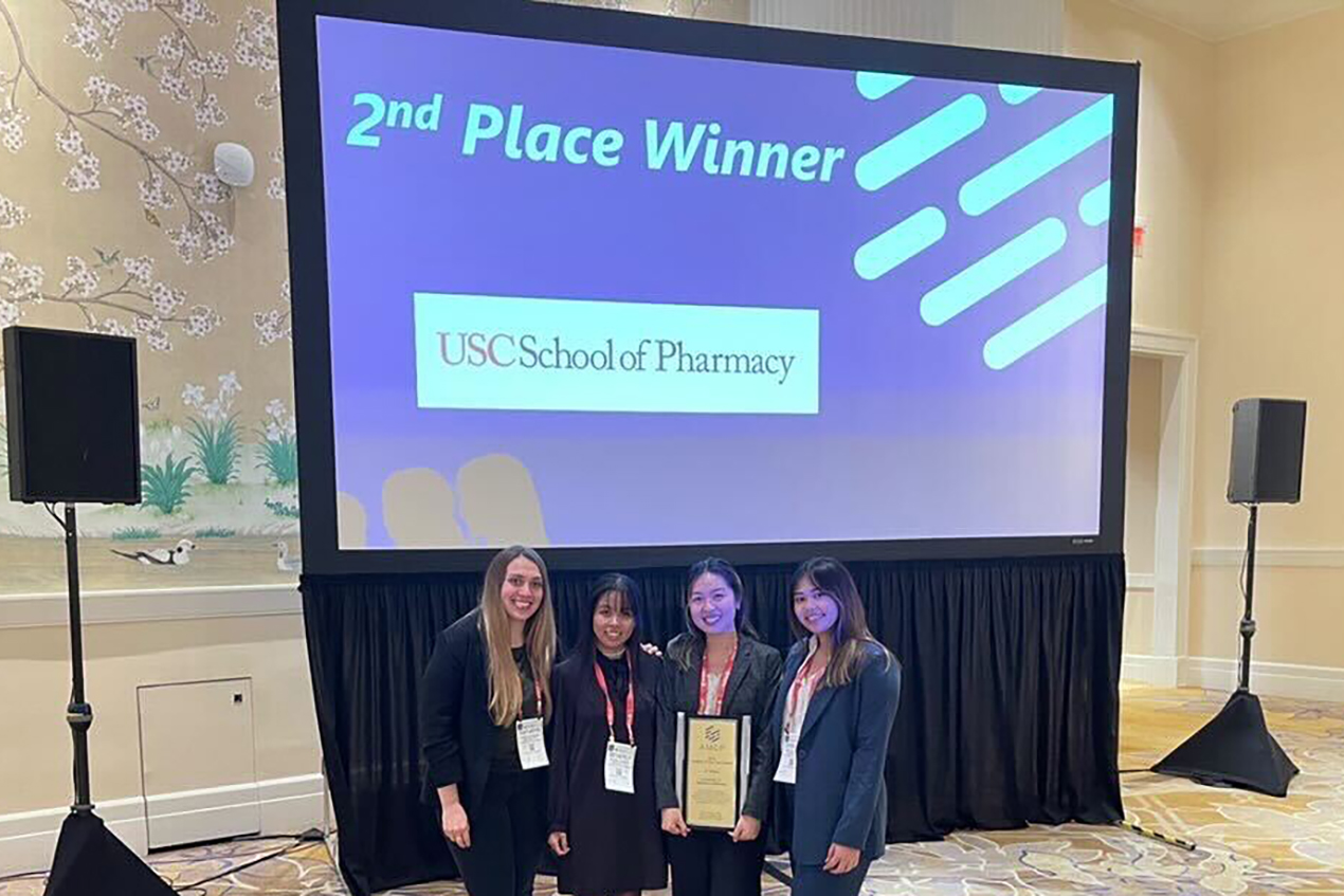 From left to right: Kathryn Perkins (student member), Beverly Fuerte (director of finance), Tiffany Huynh (president) and Mia Burgos (president-elect) represented the USC School of Pharmacy student chapter at the award ceremony.