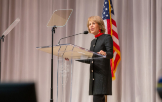 University of Southern California President Carol L. Folt speaks at a podium